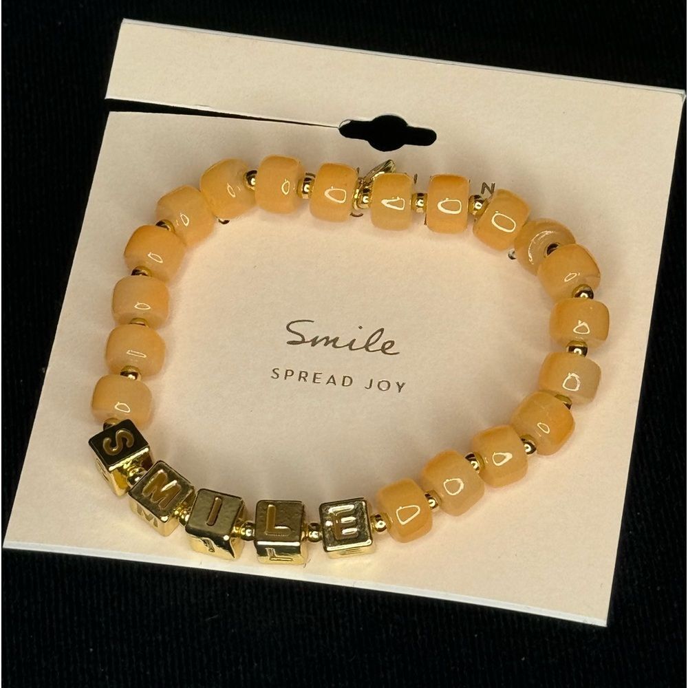 Lauren Conrad Peach Beaded Bracelet with “Smile” in Gold Beads
